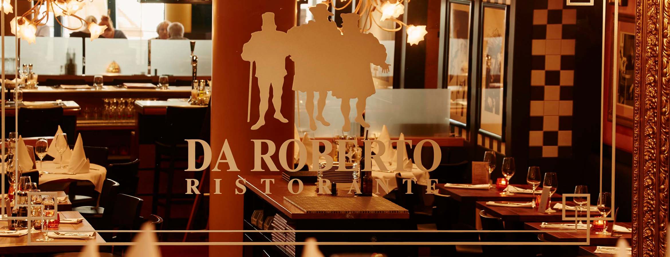 Da Ernesto Restaurant durch den Blick des Spiegels mit dem Logo des italienischen Restaurants Basel